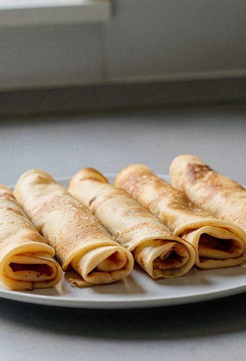 5 opgerolde pannenkoeken om op te warmen.
