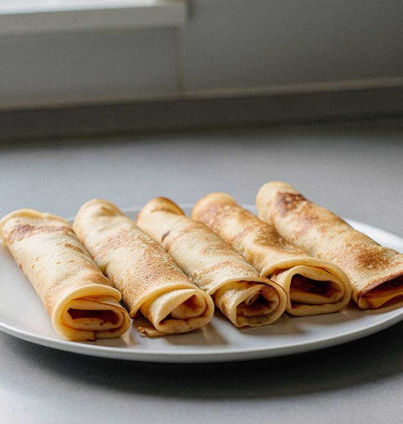 5 opgerolde pannenkoeken om op te warmen.