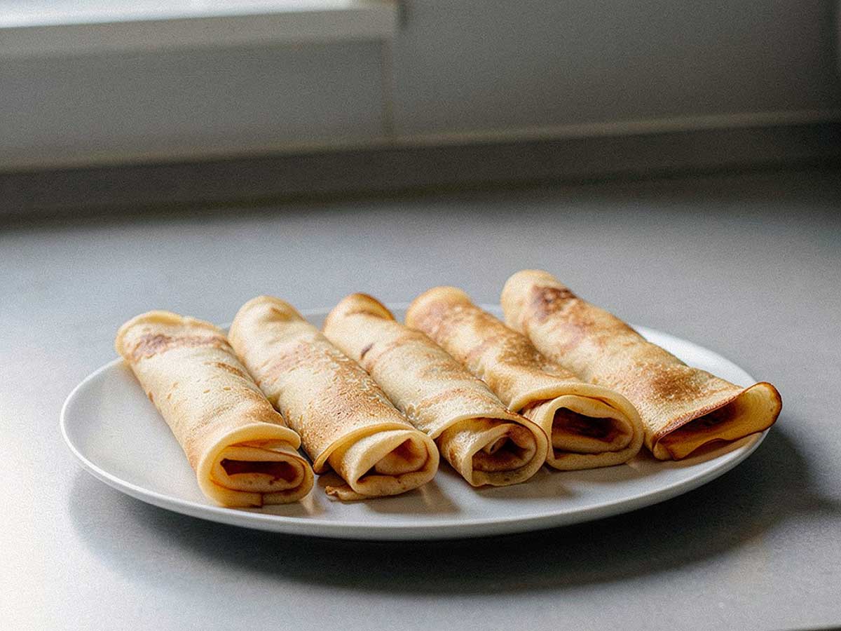 5 opgerolde pannenkoeken om op te warmen.